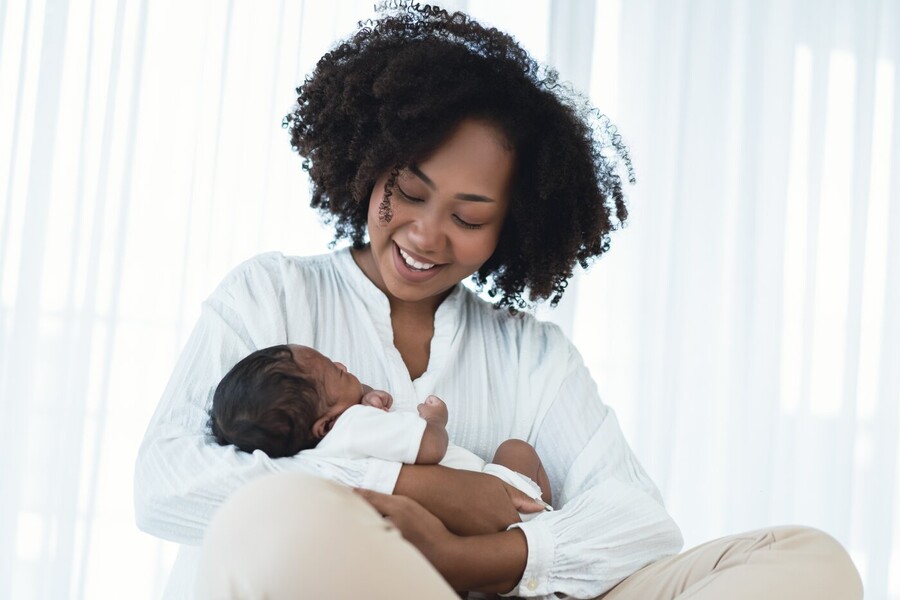 mother holding newborn baby